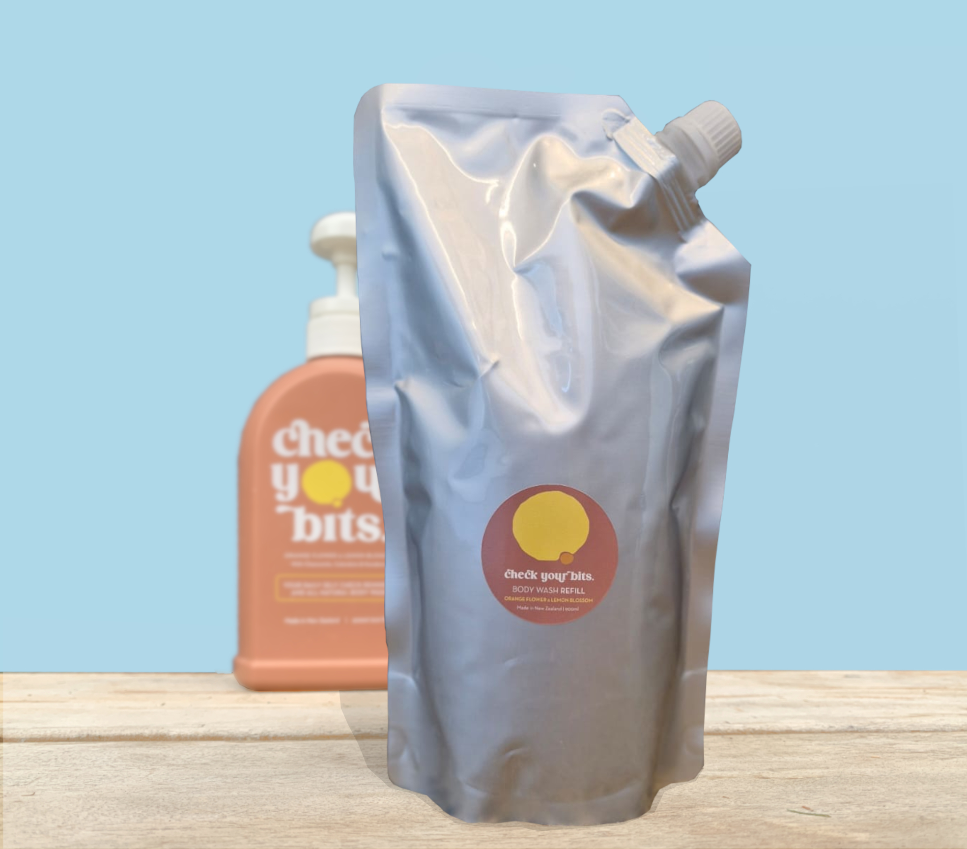 900ml Check Your Bits body wash refill pouch beside the original bottle
